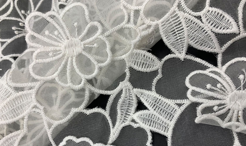 The widely used embroidered fabric: novelty embroidered mesh fabric